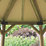 Forest HGG4MNECIN 13' 6" x 11' 6" (Nominal) Hexagonal Timber Gazebo with Base & Assembly