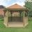 Forest HGG4MNECIN 13' 6" x 11' 6" (Nominal) Hexagonal Timber Gazebo with Base & Assembly