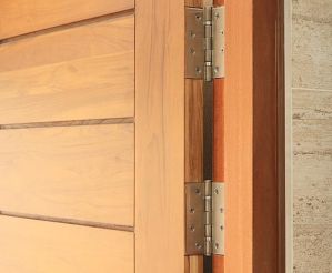 Stainless door hinges on wooden door