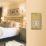 Varilight  1-Gang Dual Voltage Shaver Socket 115V Georgian Brass with White Inserts