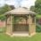 Forest HGG36MTTIN 12' x 10' (Nominal) Hexagonal Timber Gazebo with Base & Assembly