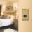 Varilight  1-Gang Dual Voltage Shaver Socket 115V Georgian Brass with Black Inserts