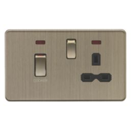 Knightsbridge Screwless 45A 2-Gang DP Cooker Switch & 13A Switched Socket Antique Brass with Neon with Black Inserts