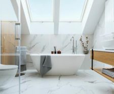 freestanding bath in bathroom with wall panels