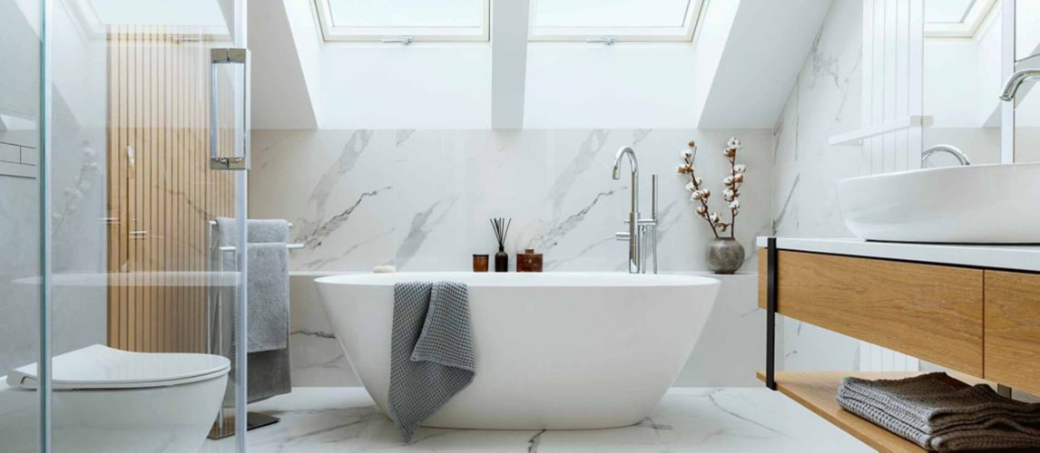 freestanding bath in bathroom with wall panels