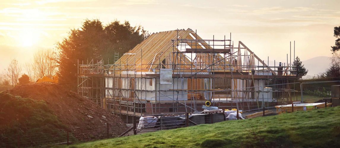 a half built house with scaffolding surrounding it