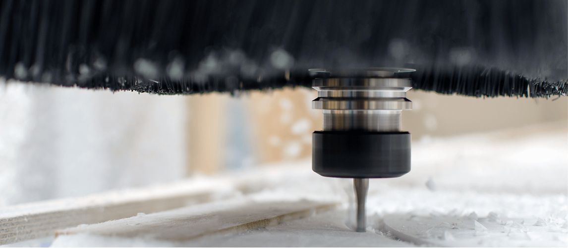 close up of blade cutting through acrylic