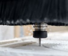 close up of blade cutting through acrylic