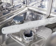 Bottom of a dishwasher sparkling clean with no standing water