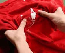 Red t-shirt with white paint stain