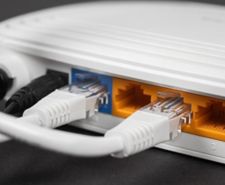 RJ45 Ethernet cables plugged into the back of a router