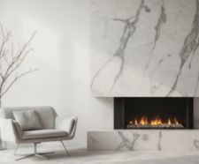 Modern living room features sleek fireplace with warm flames, accented by minimalist armchair and tall vase with dry branches.