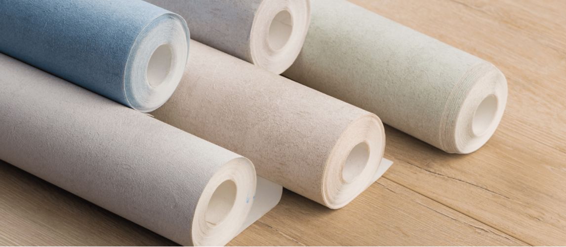 rolls of wallpaper on the floor