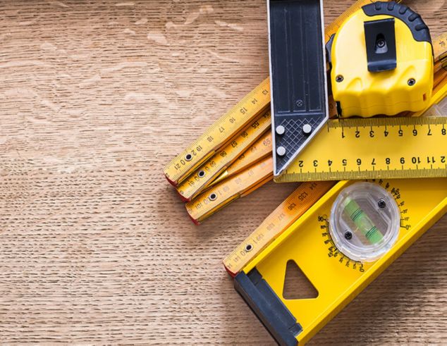 Top view of yellow soft measuring tape. Minimalist flat lay image