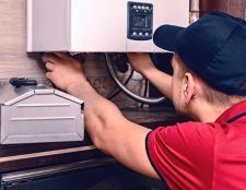 A man installing a new boiler