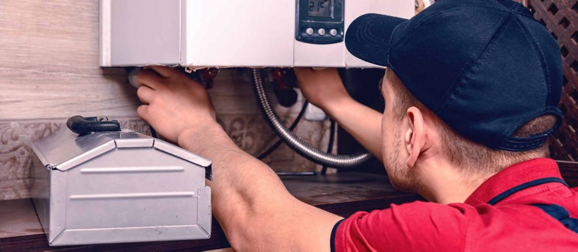 A man installing a new boiler