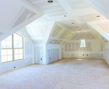 Room with unpainted plasterboard wall & ceiling