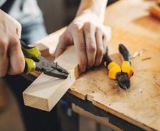Image of a nail being removed with pliers