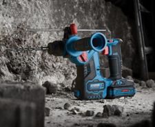 Erbauer SDS Drill placed next to a rock wall