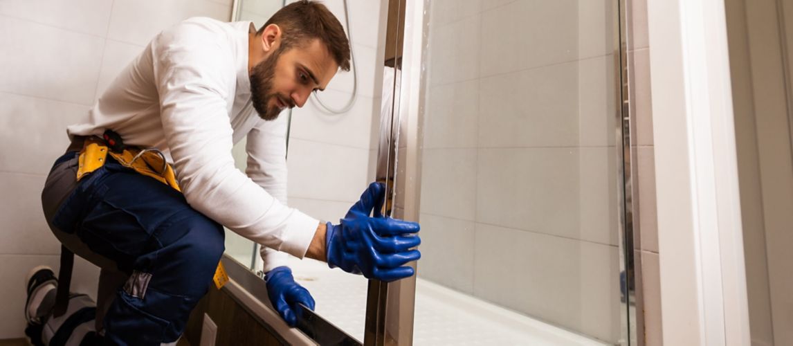 Image of someone setting up Shower Tray