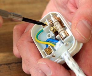 An open plug showing the three UK wiring colours